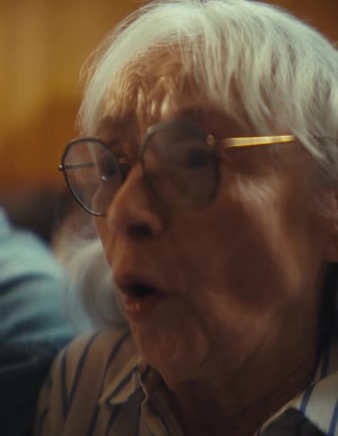 The woman looks very excited and shocked