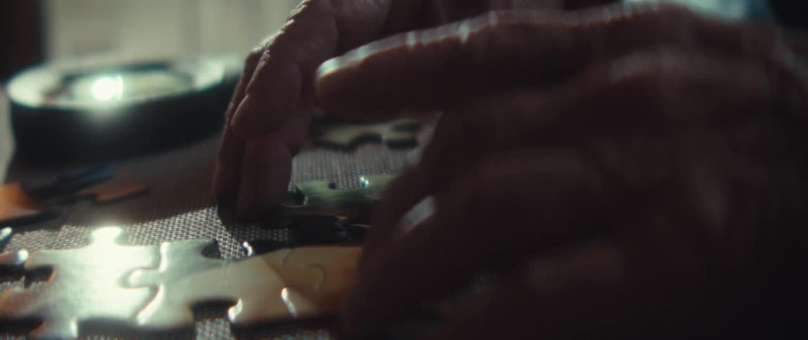 A person doing a jigsaw puzzle