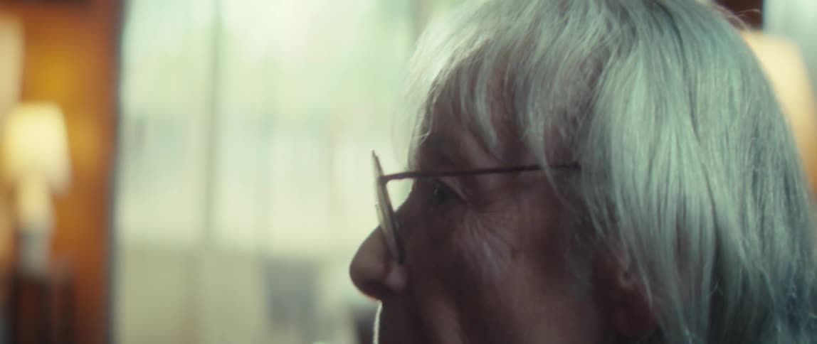 The woman turns her head at home
