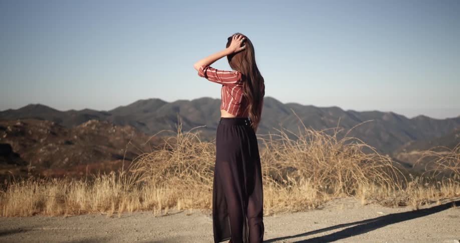 Fashionable woman in long dress outside