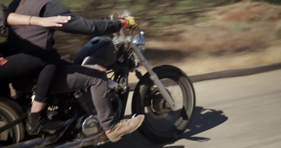 Man and woman riding on a motorcycle