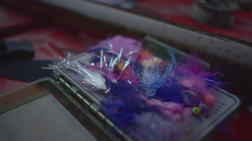 The tackle box in the boat is full of fishing lures