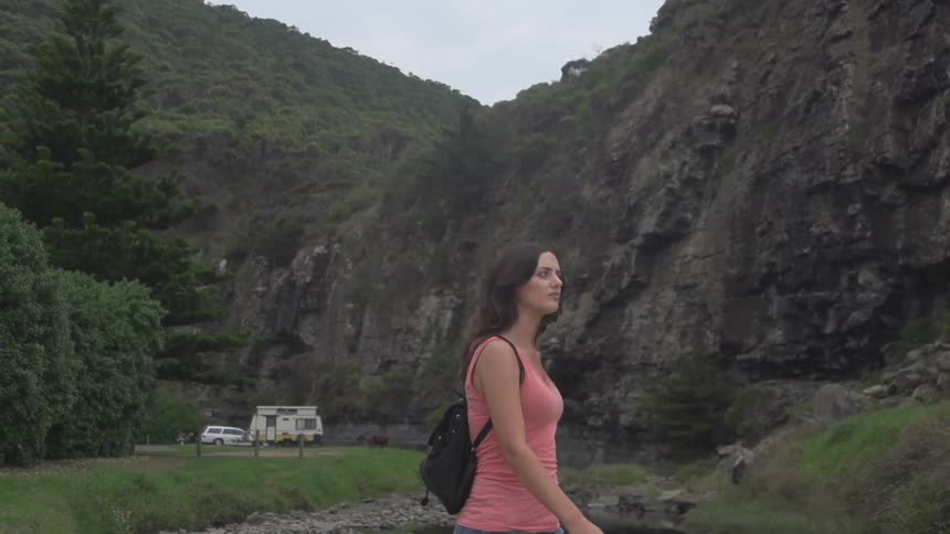 Woman walking near a mountain