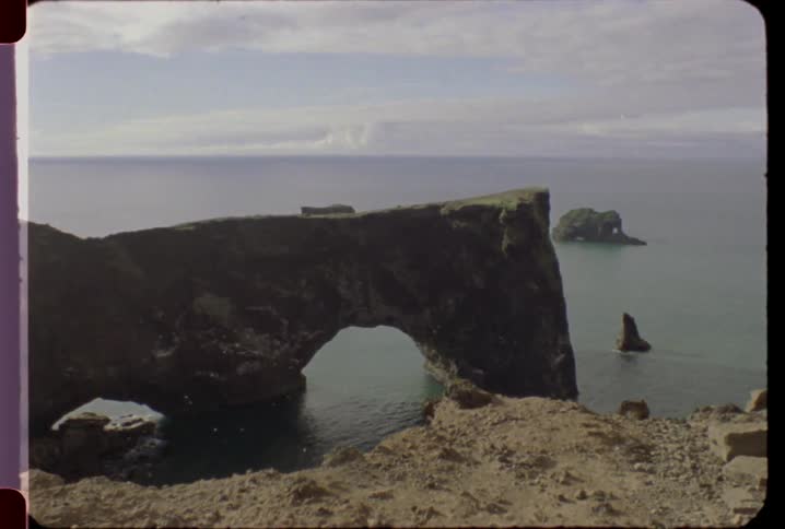 The cliff runs out into the water
