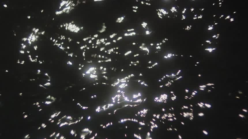 Light reflected on dark water