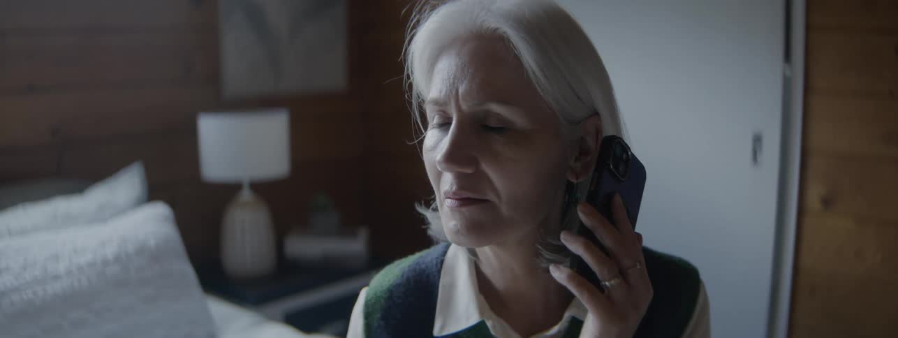 The woman gets interrupted as she talks on her cell phone