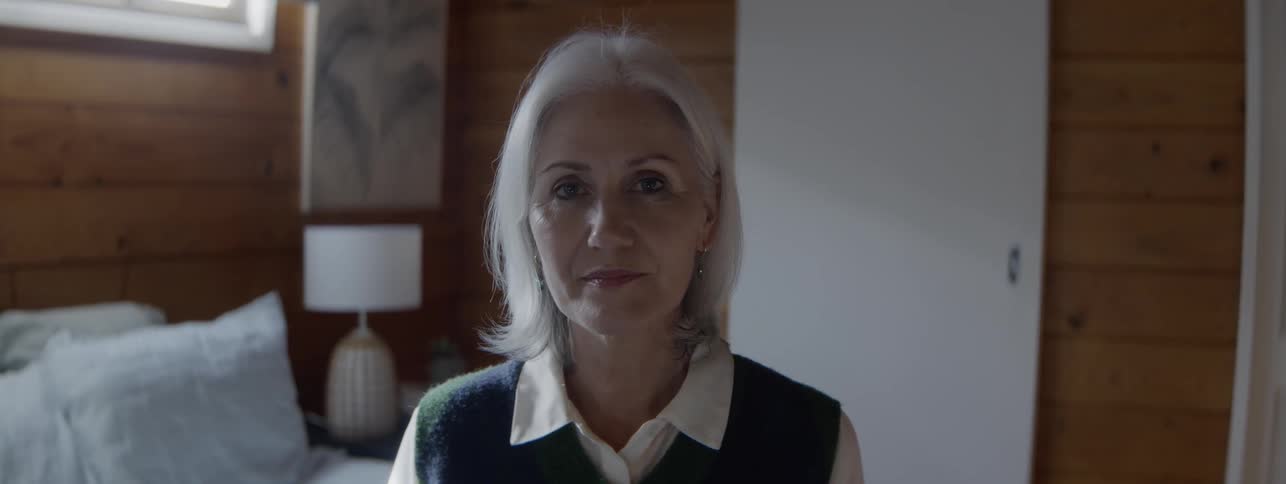 A woman looks at the camera