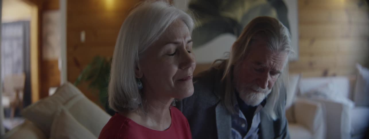 Elderly woman feels sad and lonely when realising that her husband with Alzheimers can't remember a familiar face from their phone book anymore