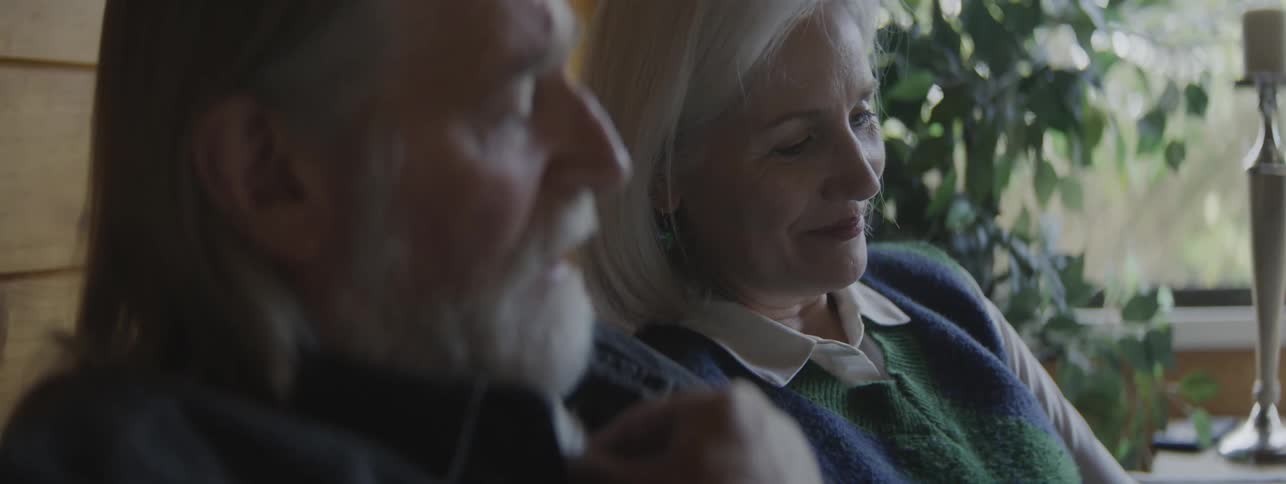Elderly couple talking and smiling together in a relaxed moment
