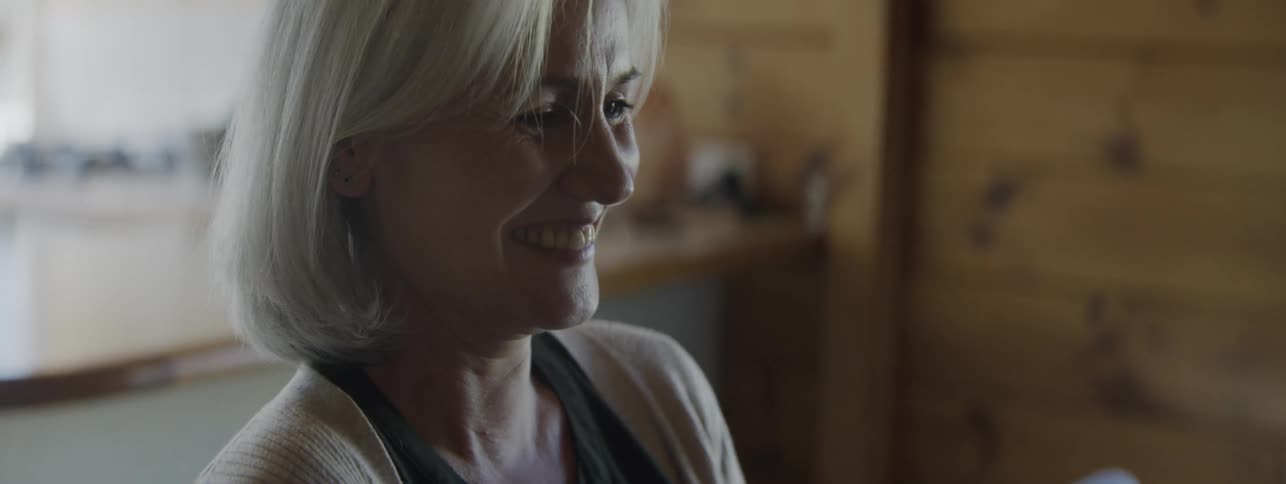 Woman laughs together with husband when he does a silly mistake, not realizing that it is the first sign of his alzheimers