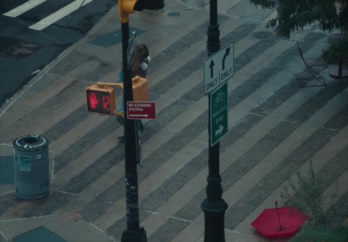 Couple hugging while crossing the crosswalk in an urban area