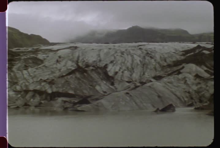 A hilly landscape and a body of water