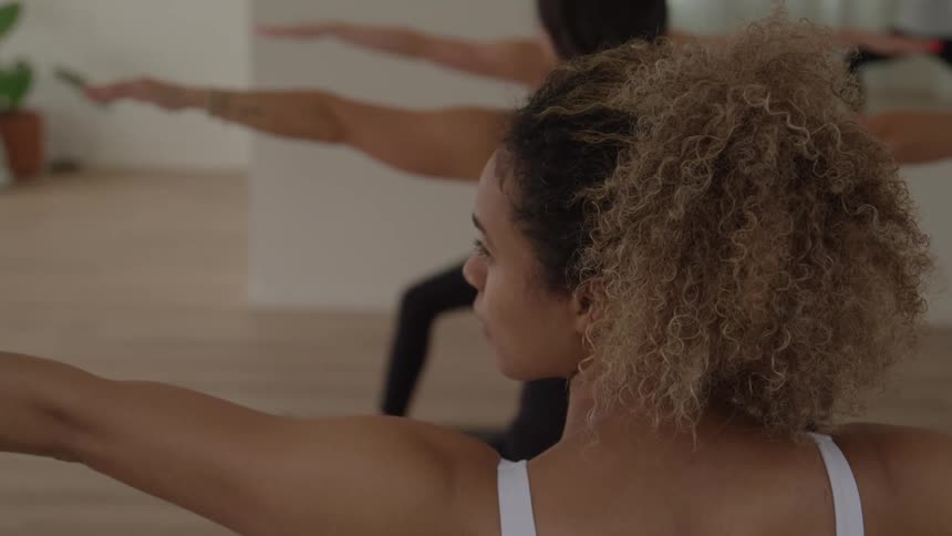Women are doing yoga in the gym