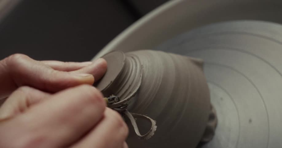 A bowl is being made on the pottery wheel