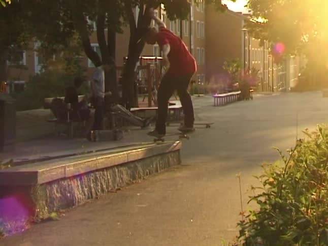 The teenager jumps with his skateboard