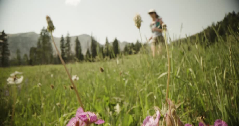 The woman runs through the valley