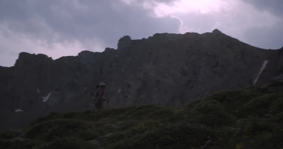 A woman runs up a hill