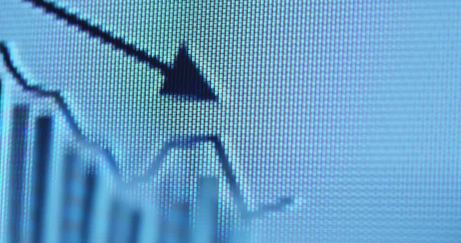 A macro view of a digital screen shows a black animated graph with a falling line chart and a downward pointing arrow overlaying vertical bar charts representing a market decline or financial loss on a white background
