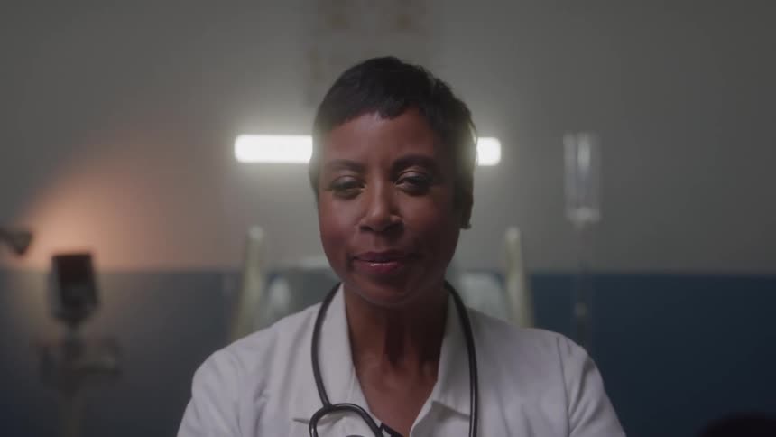The doctor is smiling in the hospital