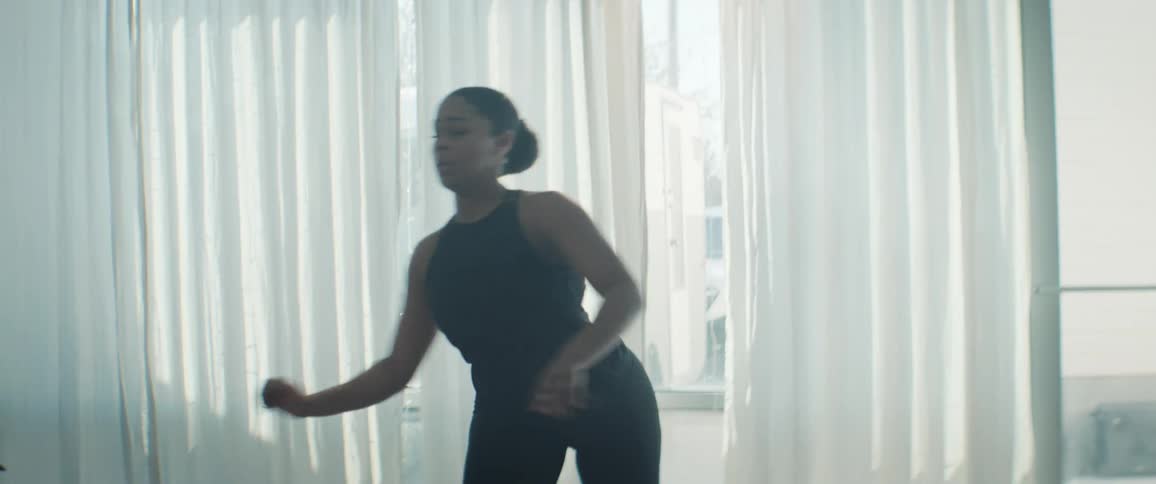 Woman dancing in an indoor space