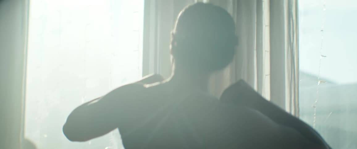 Black Female dancing in a ballroom during the day