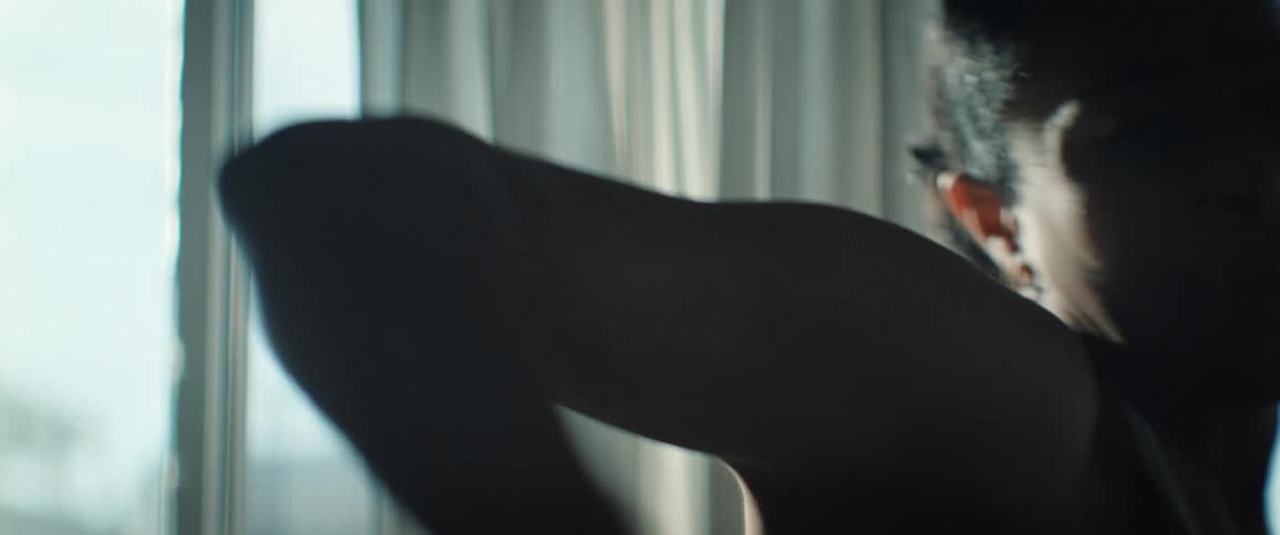 Woman in an indoor space during the day dancing