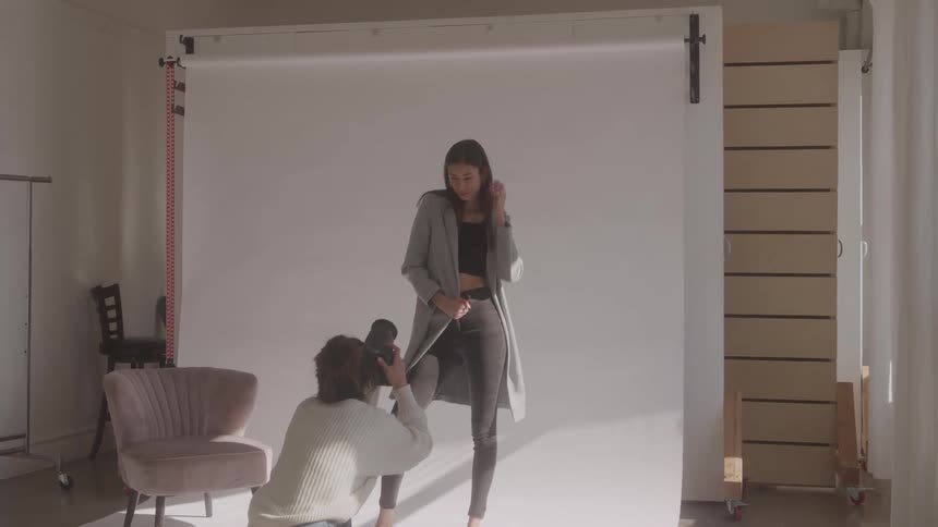 The woman is modeling in the studio