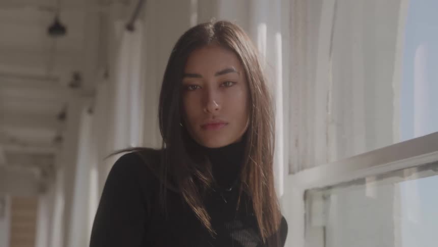 A woman poses for the camera