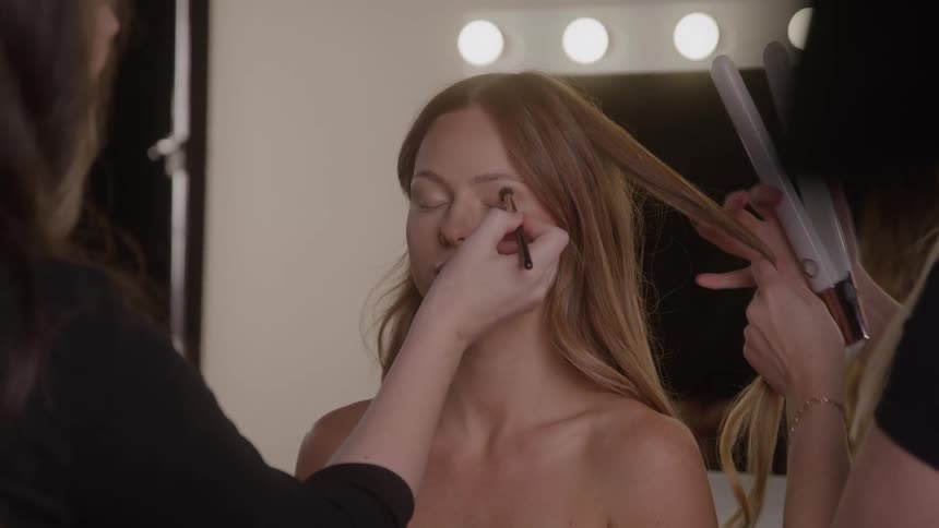 People are doing the models hair and makeup