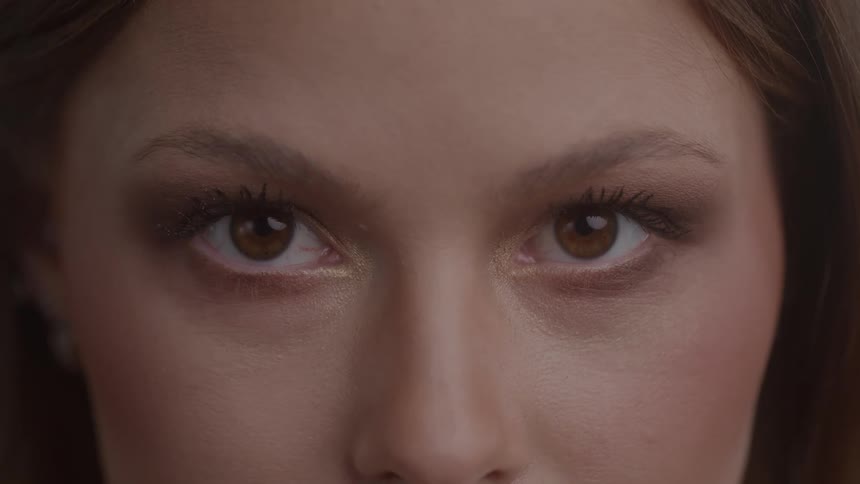 The woman slowly blinks her eyes