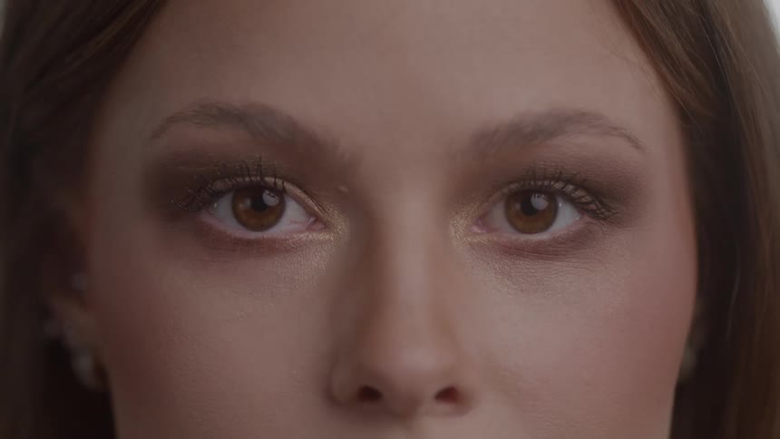 Close up of a young womans face after a makeup session