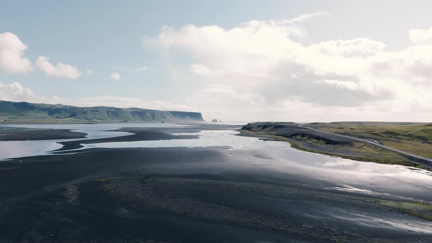 Beach next to a plateau outdoors during day time