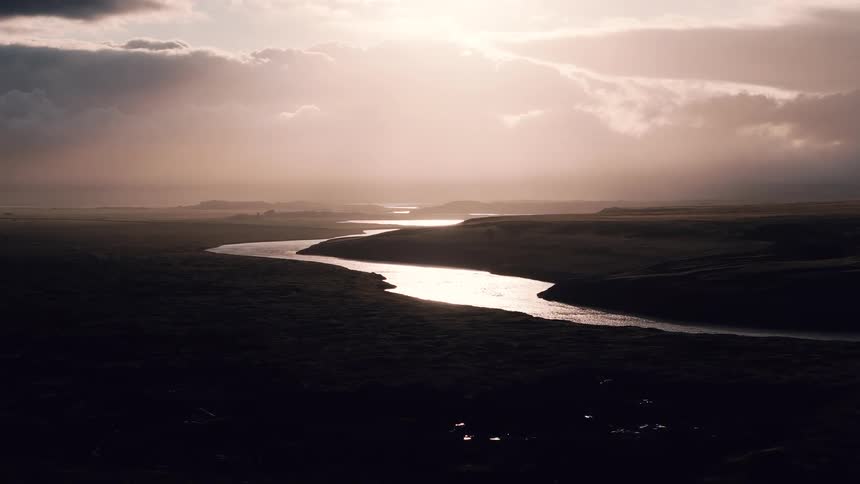 The sun is rising on the stream