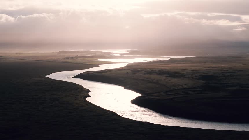 The sun is reflecting on the river