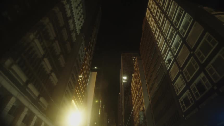 Tall buildings fill the night sky