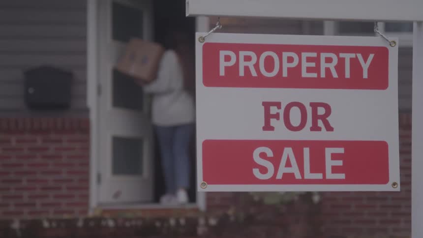 Close up of a street sign outdoors during daytime for the sale of property