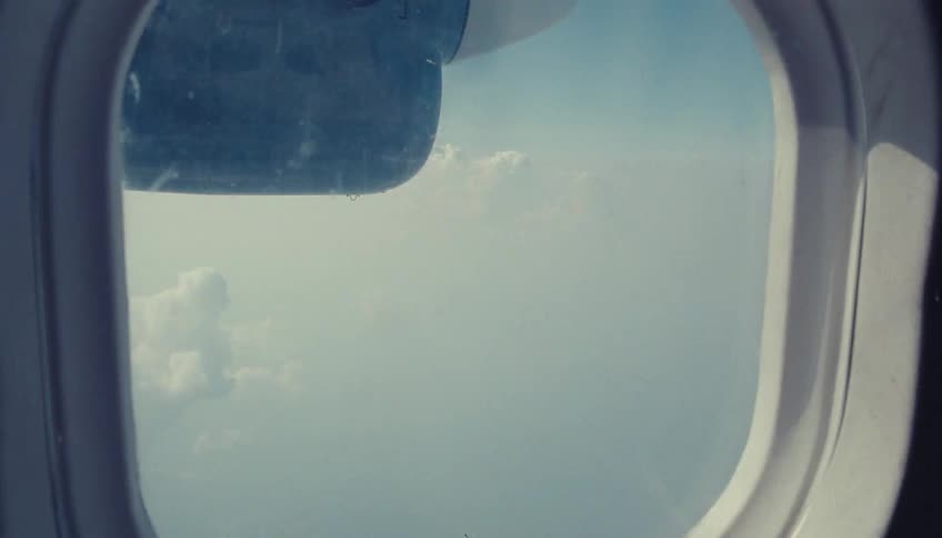 View outside of an airplane shuttle in flight during day time