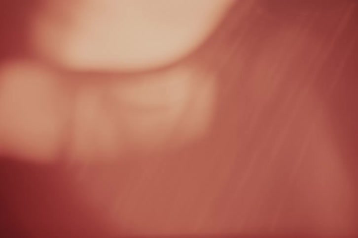 Red light over the abstract face of a person
