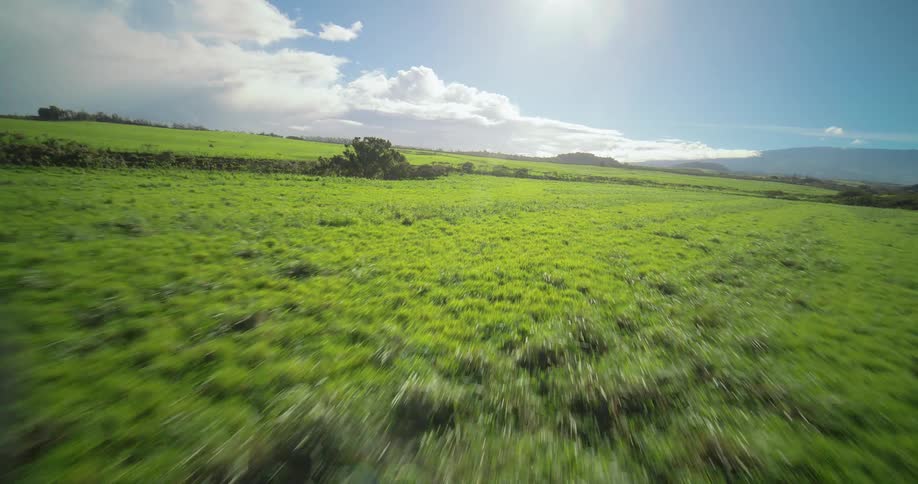 Flying over a large field