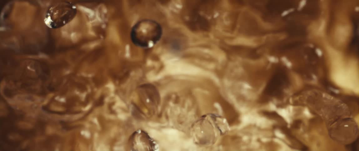 The boiling water flies droplets around