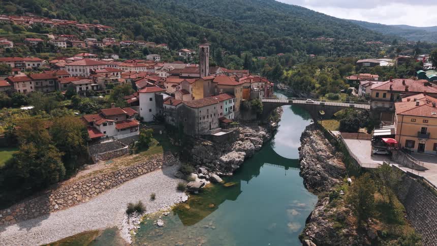 Picturesque village with colorful houses stretches along a river