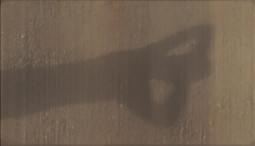 The persons shadow is on the wall