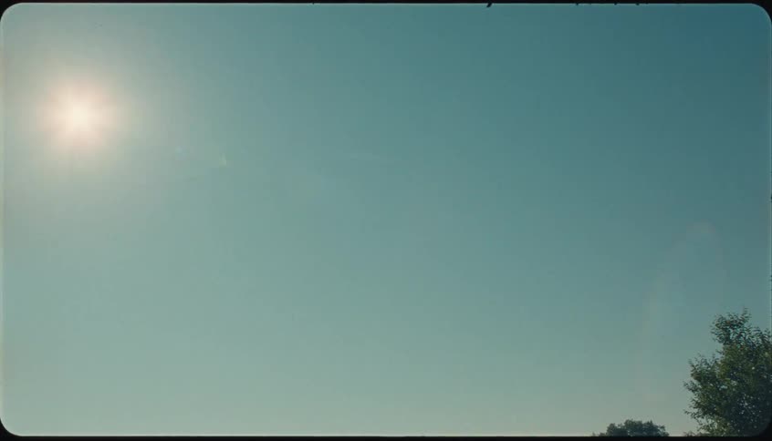 Sun shines brightly in a clear cloudless blue sky