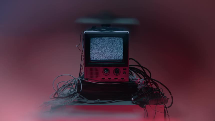 A connected electronic display device on a table in a lit room