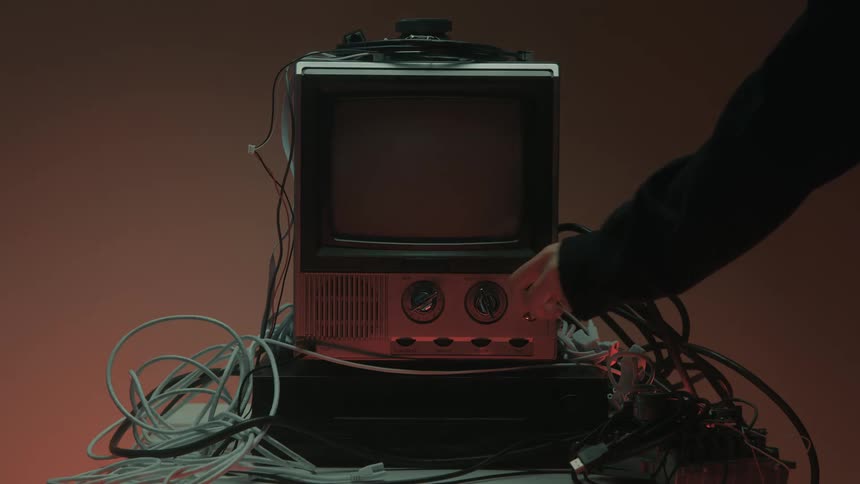 The person shuts the television off