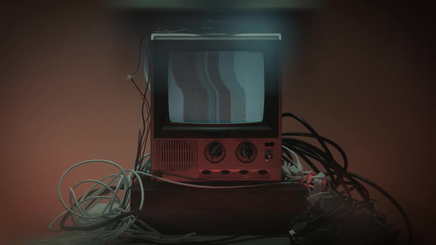 Close up of a person putting on a connected electronic display device on a table in a room