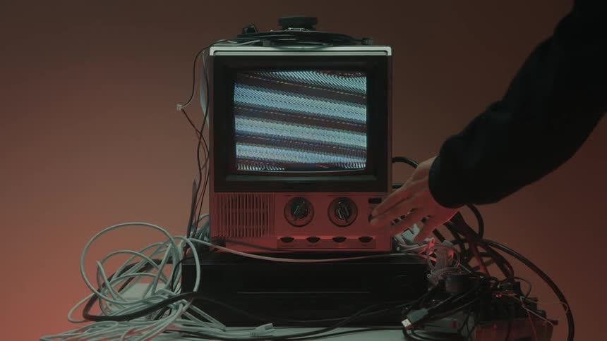The television is turned on and it is full of static