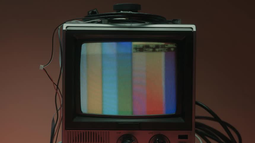 The television displays rainbow bars