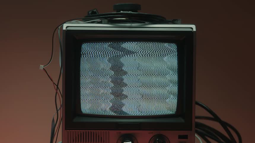Close up of a connected electronic display device on a table showing a static screen