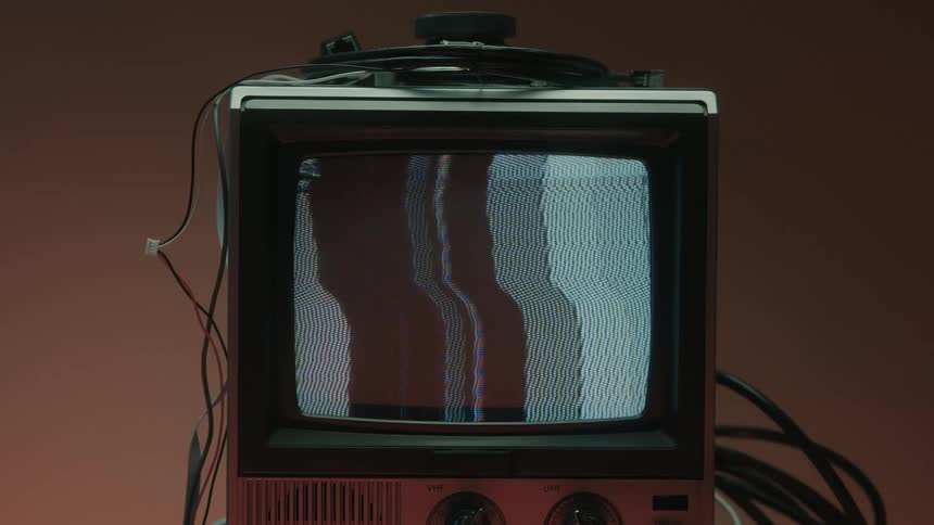 Close up of a connected electronic display device in a red lit room